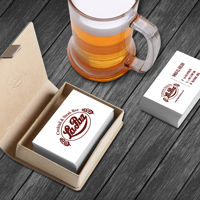 Lapaz business card with logo next to beer glass